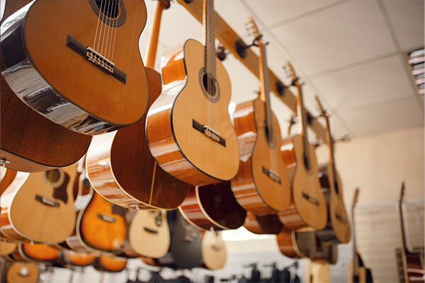 Acoustic guitar hanging on a rack